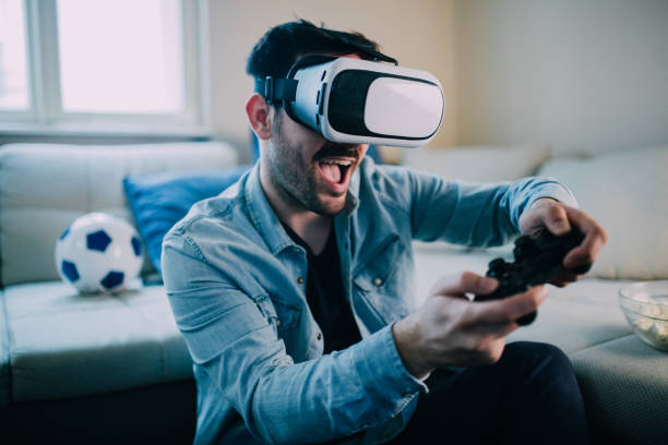 Young man enjoying virtual reality video games