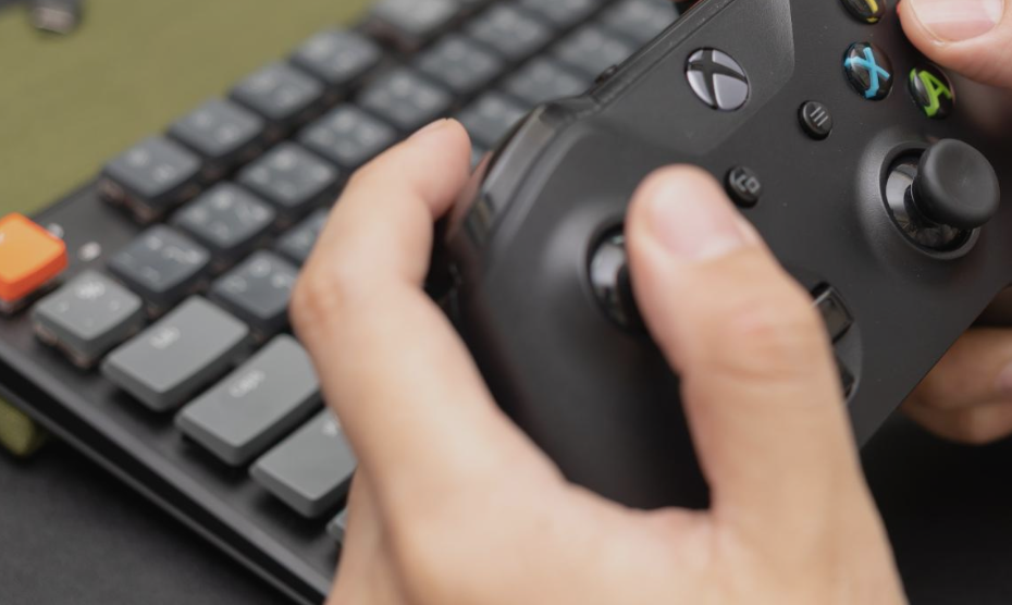 Hands using a gaming controller.